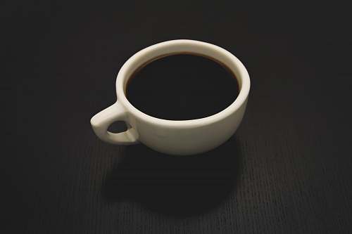 coffee cup photo of white ceramic teacup filled with liquid black